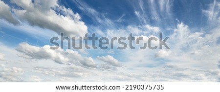 Ornamental clouds. Dramatic sky. Epic storm cloudscape. Soft sunlight. Panoramic image, texture, background, graphic resources, design, copy space. Meteorology, heaven, hope, peace concept Royalty-Free Stock Photo #2190375735