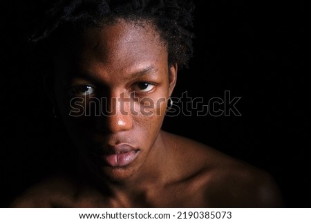 young african american man on black background copy space