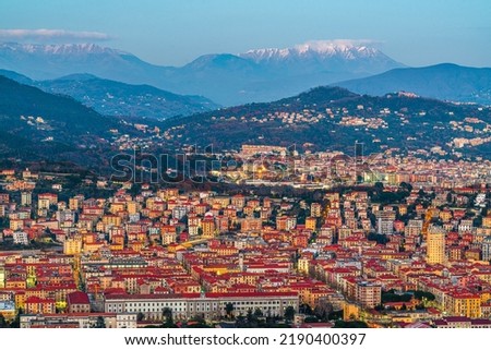 La Spezia, Italy city skyline with the Apennine Mountains at dusk.