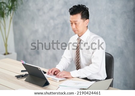 businessman doing desk work at office