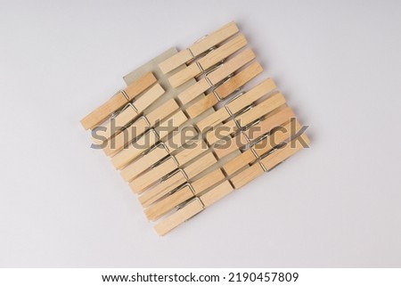 set of wooden clothespins isolated on white background Royalty-Free Stock Photo #2190457809