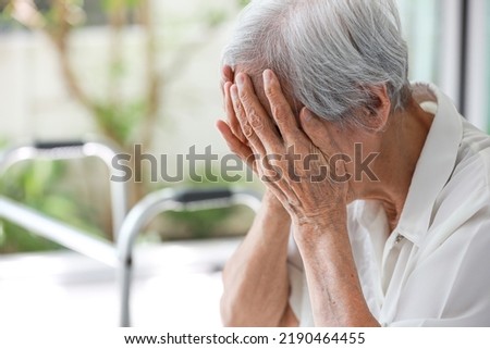 Depressed asian senior woman with depression,anxiety,depressive illness,tired old elderly patient crying alone at home,debilitating of disease,emotional problems,mood (affective)disorder,mental health Royalty-Free Stock Photo #2190464455