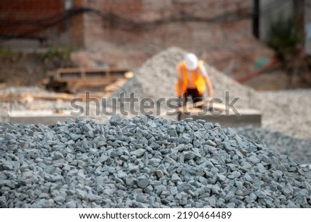 Road construction gravel texture , close up on pile of gravel for construction of a road at a construction site. Road construction background