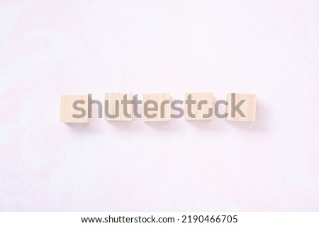 wood block with pink background for design.