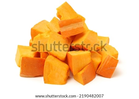 Pumpkin cubes isolated on white background 