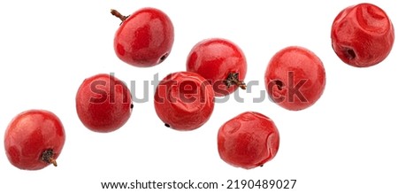 Falling red peppercorns isolated on white background Royalty-Free Stock Photo #2190489027