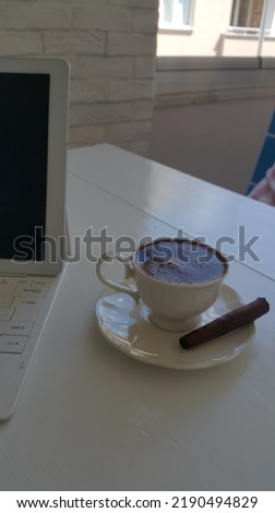 Traditional turkish coffee with cigar on white table