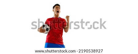 Portrait of young expressive man, football player posing isolated over white studio background. Looks extremely motivated. Concept of sport, team game, action, motion. Copy space for ad, poster Royalty-Free Stock Photo #2190538927