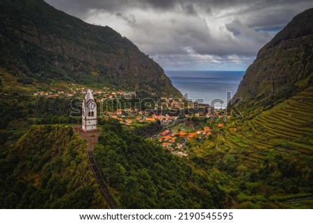 Sao Vicente or San Vicente, Madeira, Portugal - October 2021: The fragment view of Sao Vicente village from mountain. Catholic church on front. Aerial drone picture