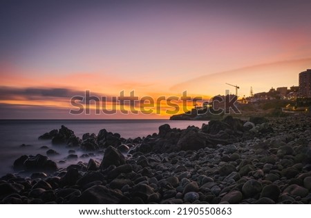 Sunrise on Reis Magos beach. Canico, Madeira, Portugal. October 2021. Long exposure picture