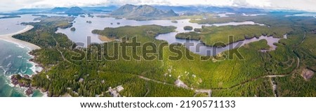 Aerial view over Tofino Pacific Rim national park with a drone from above Cox Bay Vancouver Island Canada. Sunset at long beach Tofino Vancouver Island Royalty-Free Stock Photo #2190571133