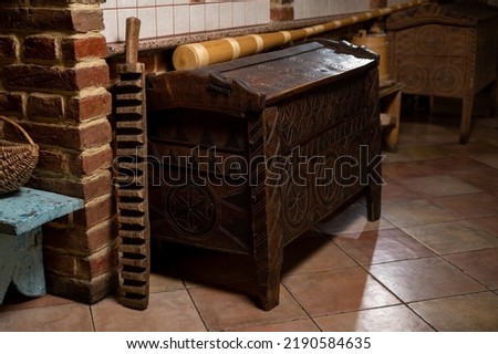 an old wooden box, a wooden product, Ukrainian products, a chest of drawers. Selective focus, slight noise, graininess