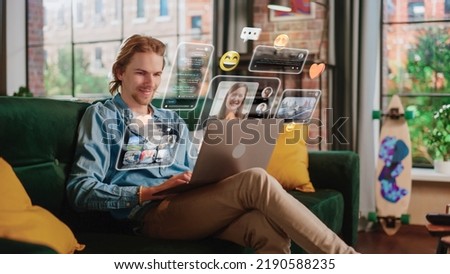 Young Handsome Man Using Laptop Computer To Check Social Media, Listen To Music, and Read Emails. Creative Person Catching Up With Friends Online. 3D Visualization of Online Platforms Concept. Royalty-Free Stock Photo #2190588235