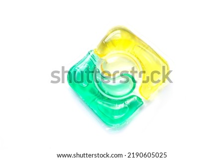 Single gel laundry detergent or washing capsule pod isolated on white background