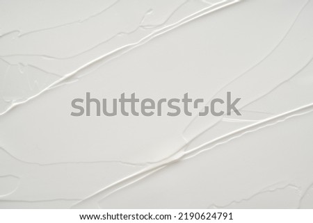 Creamy foundation texture isolated. Smear of face cream isolated. Texture of cream background Royalty-Free Stock Photo #2190624791