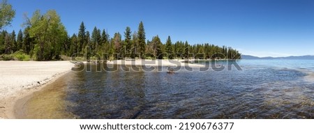 Panoramic View of Beach with Sand at Lake surrounded by Mountains and Trees. Sugar Pine Point Beach, Tahoma, California, United States. Sugar Pine Point State Park. Nature Background. Panorama
