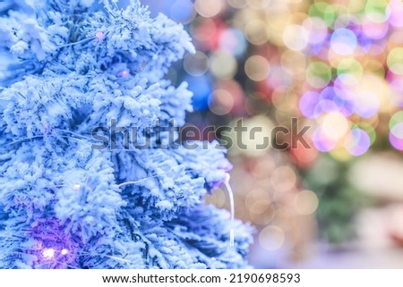 Close-up of a white Christmas tree. Christmas background with bokeh light, blurred background. High quality photo