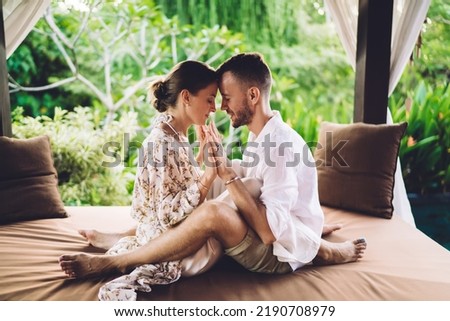 Calm male and female enjoying body and spiritual contact during daytime for teamwork therapy concentration for reunion, mindfulned couple in love touching hands during weekend spending at terrace Royalty-Free Stock Photo #2190708979