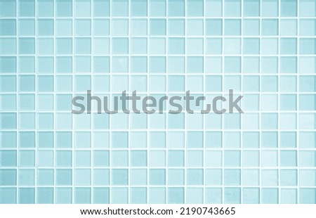 Blue light ceramic wall chequered and floor tiles mosaic background in bathroom, kitchen. Design pattern geometric with grid wallpaper texture decoration pool. Simple seamless abstract surface clean. Royalty-Free Stock Photo #2190743665