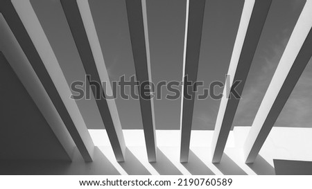 concept of artistic and abstract architecture of columns with sunset sun and clean sky background. symmetry and beauty in construction.
