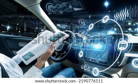 Interior of autonomous car. Driverless vehicle. Driving assist system. HUD (Heads up display). Royalty-Free Stock Photo #2190776511