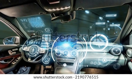 Interior of autonomous car. Driverless vehicle. Driving assist system. HUD (Heads up display). Royalty-Free Stock Photo #2190776515
