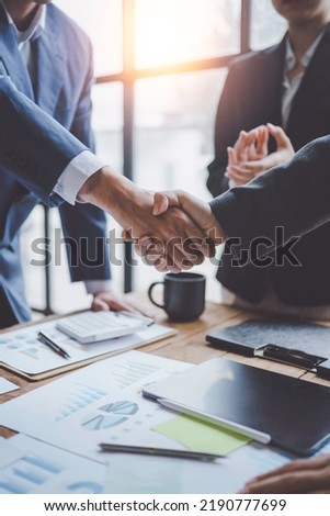 Business people shake hand to confirm the agreement in the business of mutual investment and agree on a unified work contract. Royalty-Free Stock Photo #2190777699