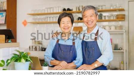 old asian couple smilimg happily in the coffee shop Royalty-Free Stock Photo #2190782997
