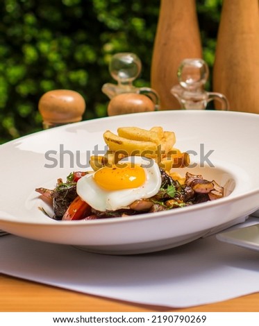 Lomo saltado beef sauted meat traditional peruvian cuisine Royalty-Free Stock Photo #2190790269