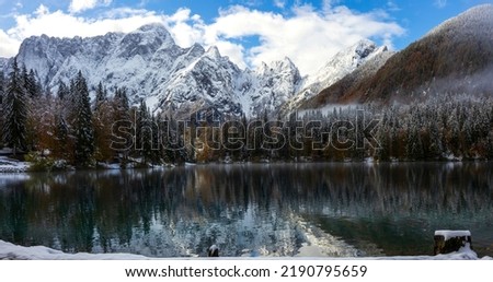 Panoramic of Lower Fusine Alpine Lake in Julian Alps with Mount Mangart in Upper Center of the Photograph