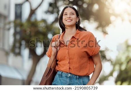 Stylish, happy and trendy student walking in a city, commuting to a college and enjoying a weekend break downtown. Smiling, edgy or funky woman exploring, visiting and enjoying town while Royalty-Free Stock Photo #2190805739