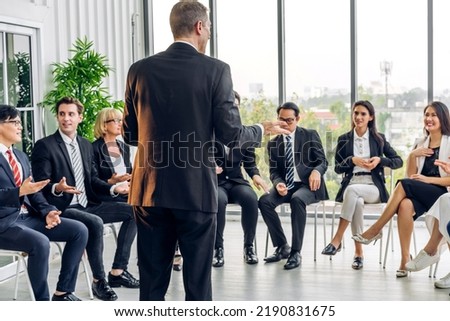 Businessman coach speaker presentation and discussing meeting strategy sharing idea.Creative team casual business people seminar and brainstorm in conference seminar at hall.presentation and teamwork
