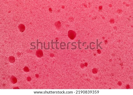 Background, photo of pink foam rubber texture, close-up.
