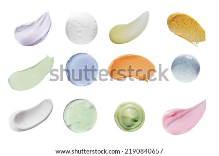 Smears of different colors cosmetic products isolated on a white background. Texture of multi-colored swatch of various make-up and care cosmetics on a white background. Collage