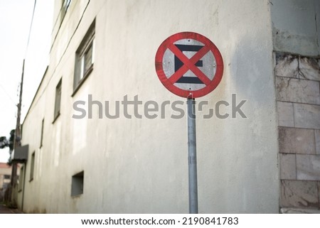 Traffic sign with signage in the middle of a city