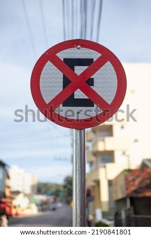 Traffic sign with signage in the middle of a city