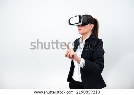 Woman Wearing Vr Glasses And Pointing On Important Messages With One Finger. Businesswoman Having Virtual Reality Eyeglasses And Showing Crutial Informations.