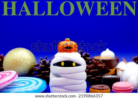 Halloween ghost and a lot of sweets