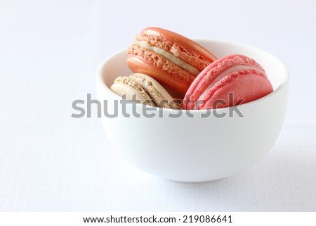 Sweet and colourful french macaroons on white background