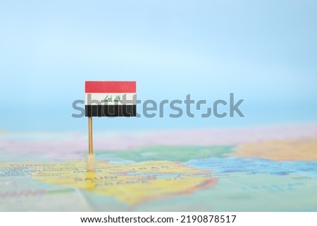 Selective focus of Iraqi flag in world map. Iraq country location and sovereignty concept. Royalty-Free Stock Photo #2190878517