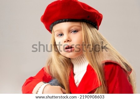 Beautiful little girl toddler wearing fashion coat and hat