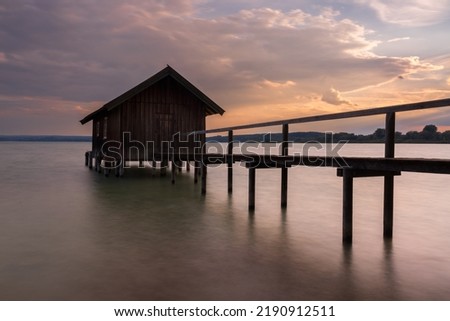 Boathouse at a lake in Bavaria Royalty-Free Stock Photo #2190912511