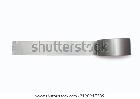 A spool of gray duct tape is unwound and pasted to a white background. Adhesive tape for repair work and construction. Adhesive tape for moisture protection or for assembly and packaging Royalty-Free Stock Photo #2190917389