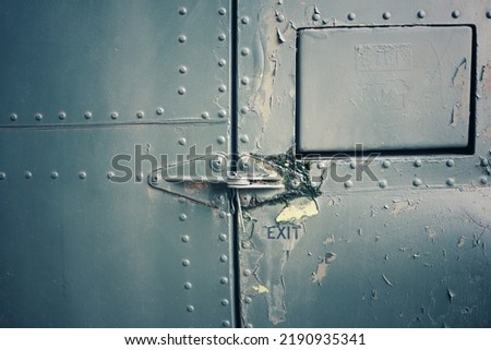 Metal plate texture and nut of military aircraft hull selectable focus image for background.