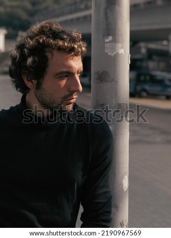 A stylish portrait of a charismatic man in the city  Royalty-Free Stock Photo #2190967569