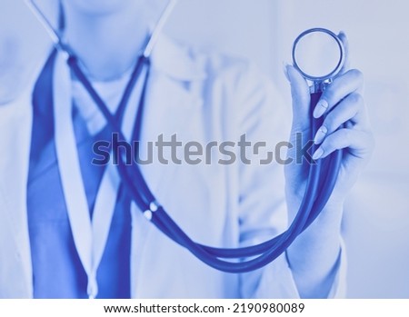 Smiling medical doctor woman with stethoscope in hospital