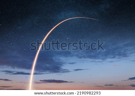 New space shuttle with a light trail flies into the amazing starry sky. Beginning a space mission and exploring the cosmos. Successful rocket launch. Rocket launch to the space with bright light. Royalty-Free Stock Photo #2190982293