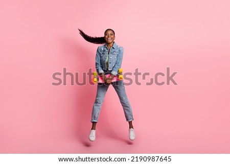 Full size photo of good mood cool girl laughing go skating on summer weekend isolated on pink color background