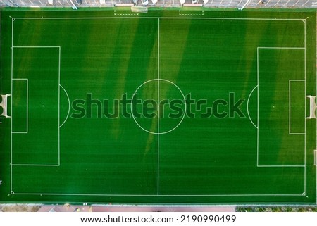 Aerial photographic documentation of an empty green football pitch 