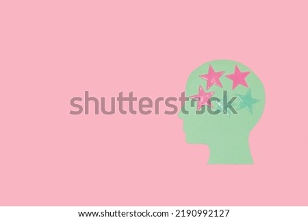 pastel blue head with stars instead of brain, pink background, creative art design, copy space